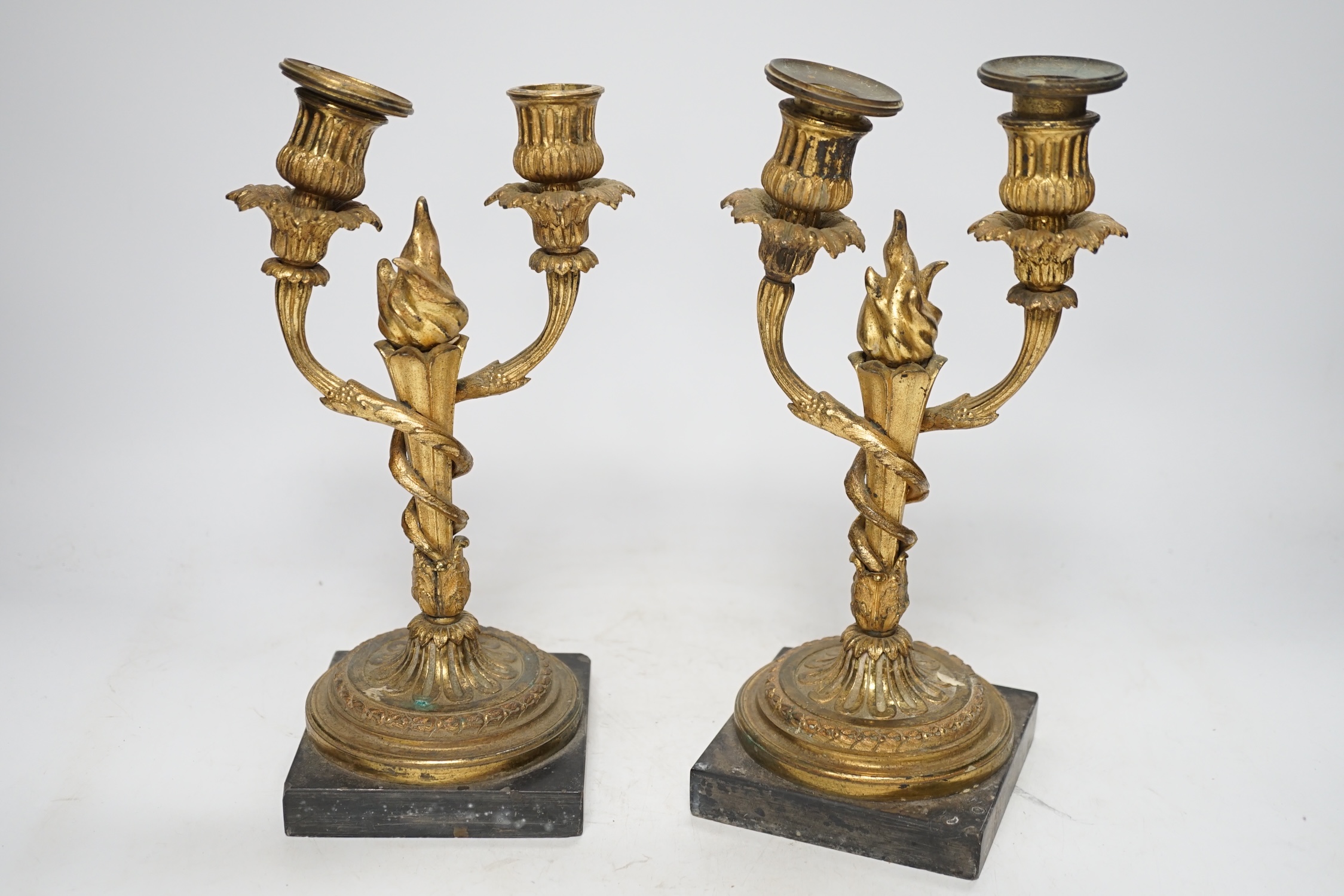 A pair of 19th century Louis XVI style gilt metal twin branch candelabra, 27cm. Condition - poor to fair